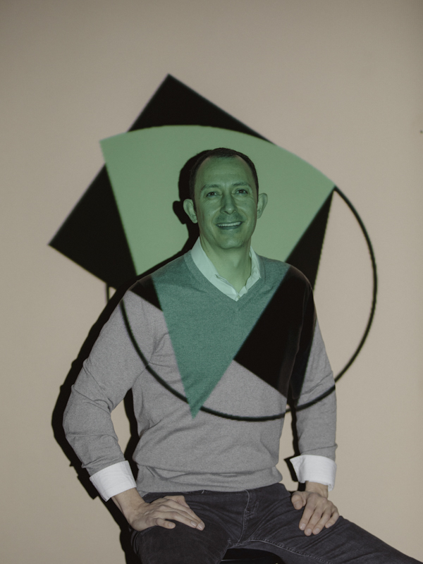 Portrait of José Viramontes with a decorative pattern projected onto him