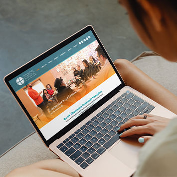 The Albuquerque Community Foundation website displayed on a laptop