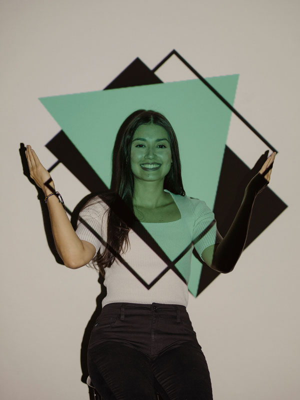 Portrait of Katherine Contreras with a decorative pattern projected onto her